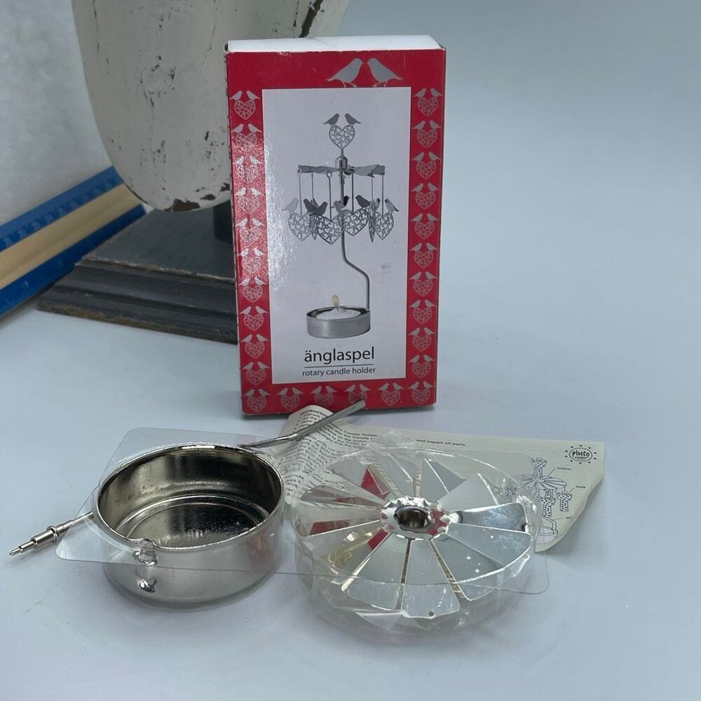 Anglaspel Pluto rotary love bird candle holder new in box.